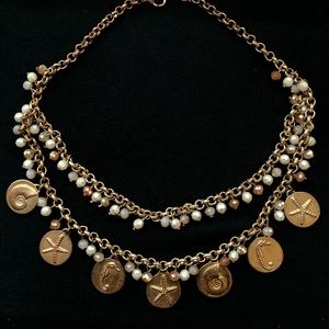 Rose gold necklace/earrings with beach accents.